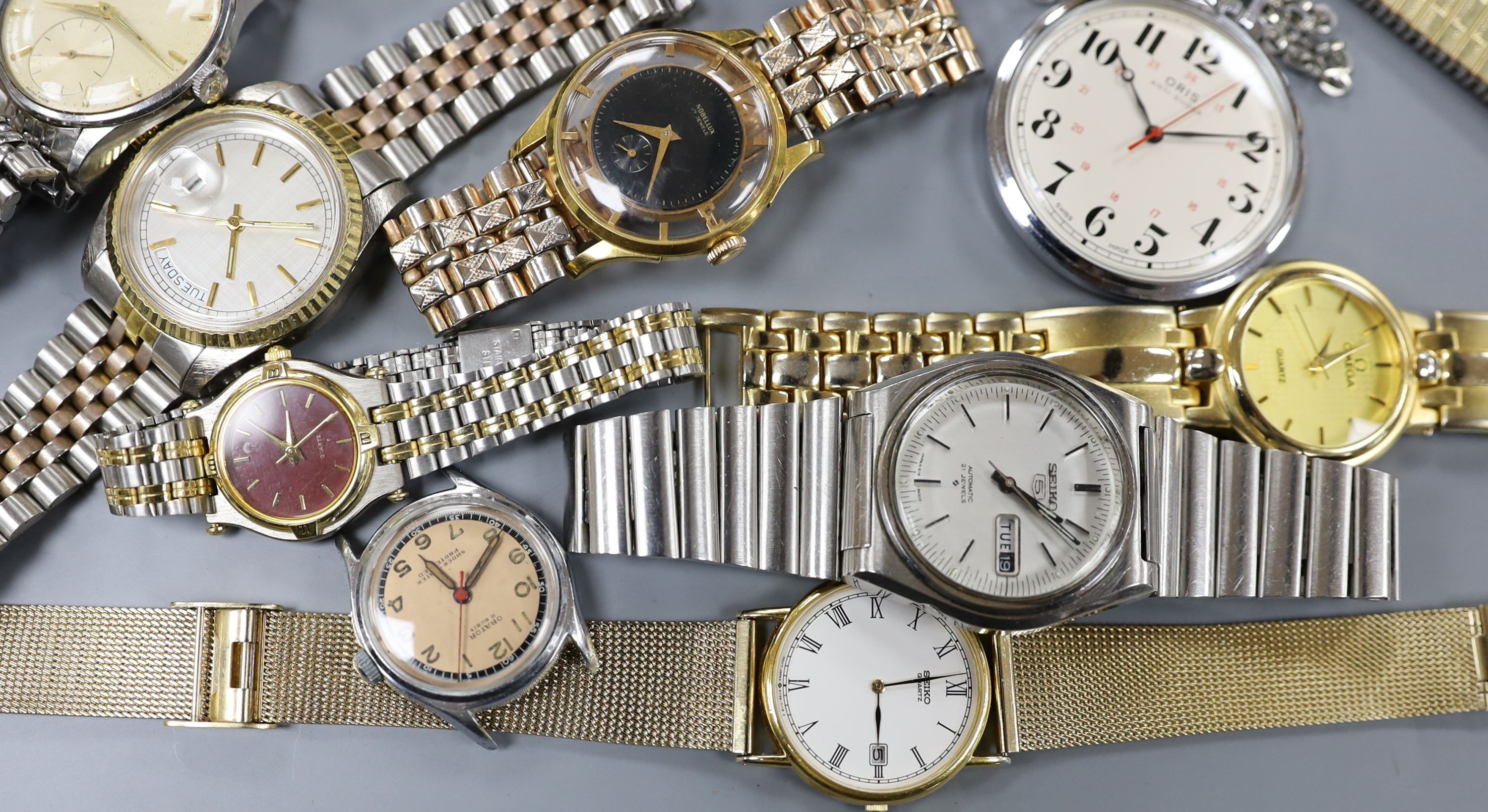 A gentleman's mid 20th century stainless steel Omega manual wrist watch, case diameter 35mm, on associated bracelet, together with eight other assorted wrist watches including Seiko and Silvan, an Oris pocket watch and t